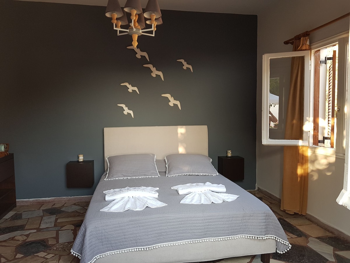 Double bedroom with open shutter windows